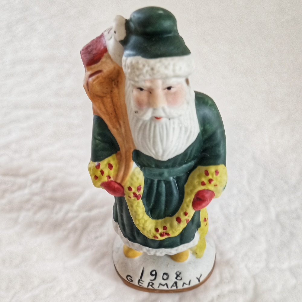 Vintage Santa Claus Figurine with Green and Red Accents